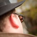 Rear View Spy Glasses - Man using the mirror